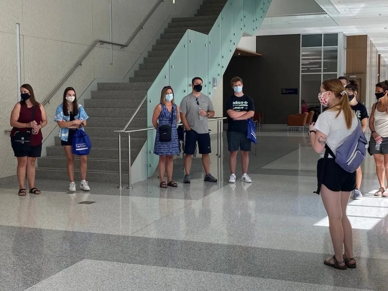 Prospective UW-Eau Claire students tour campus Friday, wearing masks to prevent the spread of COVID-19. Masks will be required of students and faculty on campus when classes begin at the university and other UW System campuses in two weeks.