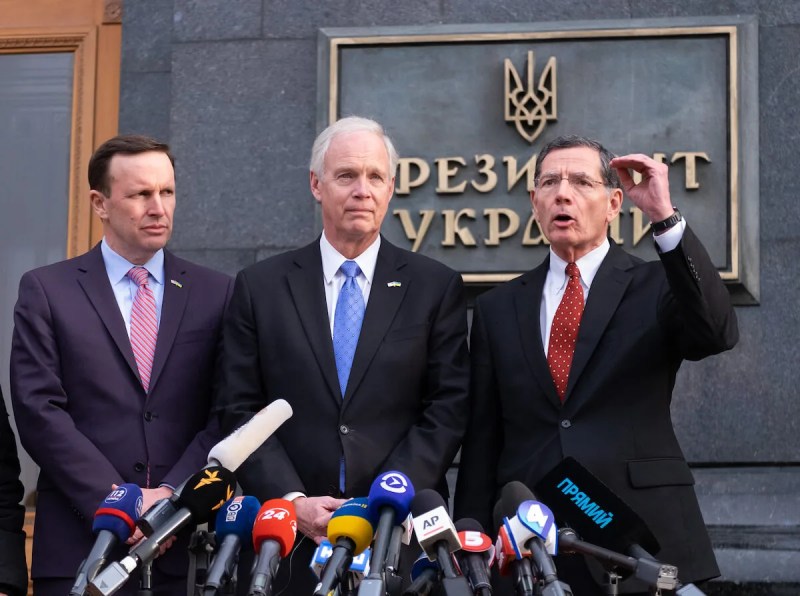 Sen. Ron Johnson (R-WI) stands between Sens. Chris Murphy (D-Conn.) and John Barrasso (R-Wyoming) during a news briefing following a Feb. 14, 2020 meeting with Ukrainian President Volodymyr Zelenskiy in Kyivv, Ukraine. (Shutterstock)