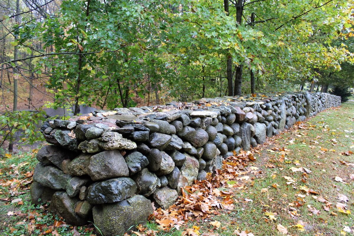 Joe Weinbauer’s handcrafted additions are dry fencing, which means no cement is used to keep the stones in place.