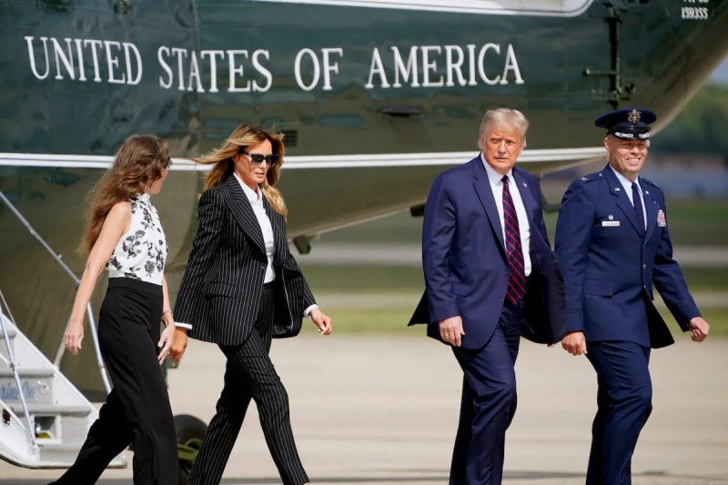 President Donald Trump and first lady Melania Trump walk to board Air Force One to travel to the first presidential debate in Cleveland, Tuesday, Sept. 29, 2020, in Andrews Air Force Base, Md.