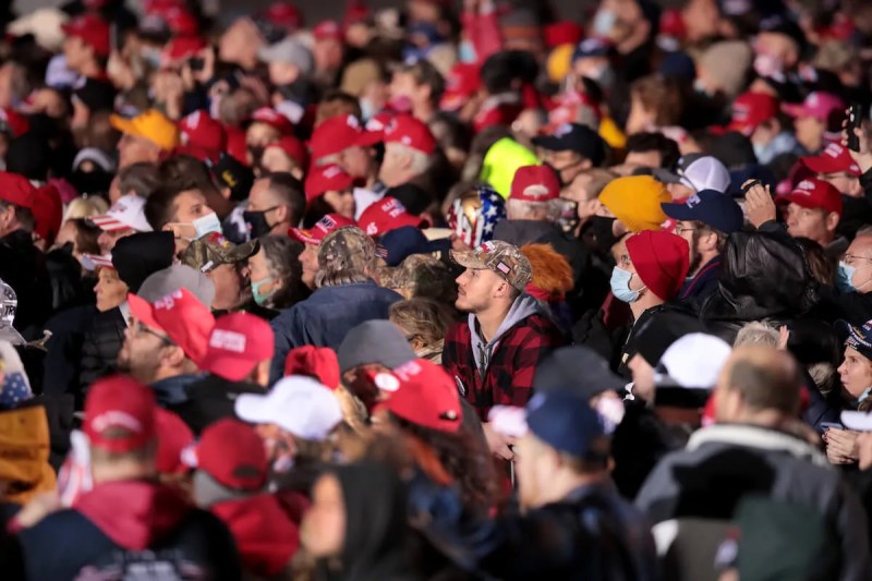 Supporters of President Donald Trump pack together at a campaign rally at the Southern Wisconsin Regional Airport on October 17, 2020 in Janesville, Wisconsin.