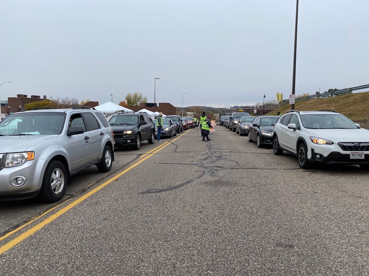 Long lines of vehicles showed up for an Oct. 20 absentee voting time organized by Eau Claire elections officials to allow people to vote absentee for the Nov. 3 presidential election. (Photo by Julian Emerson)