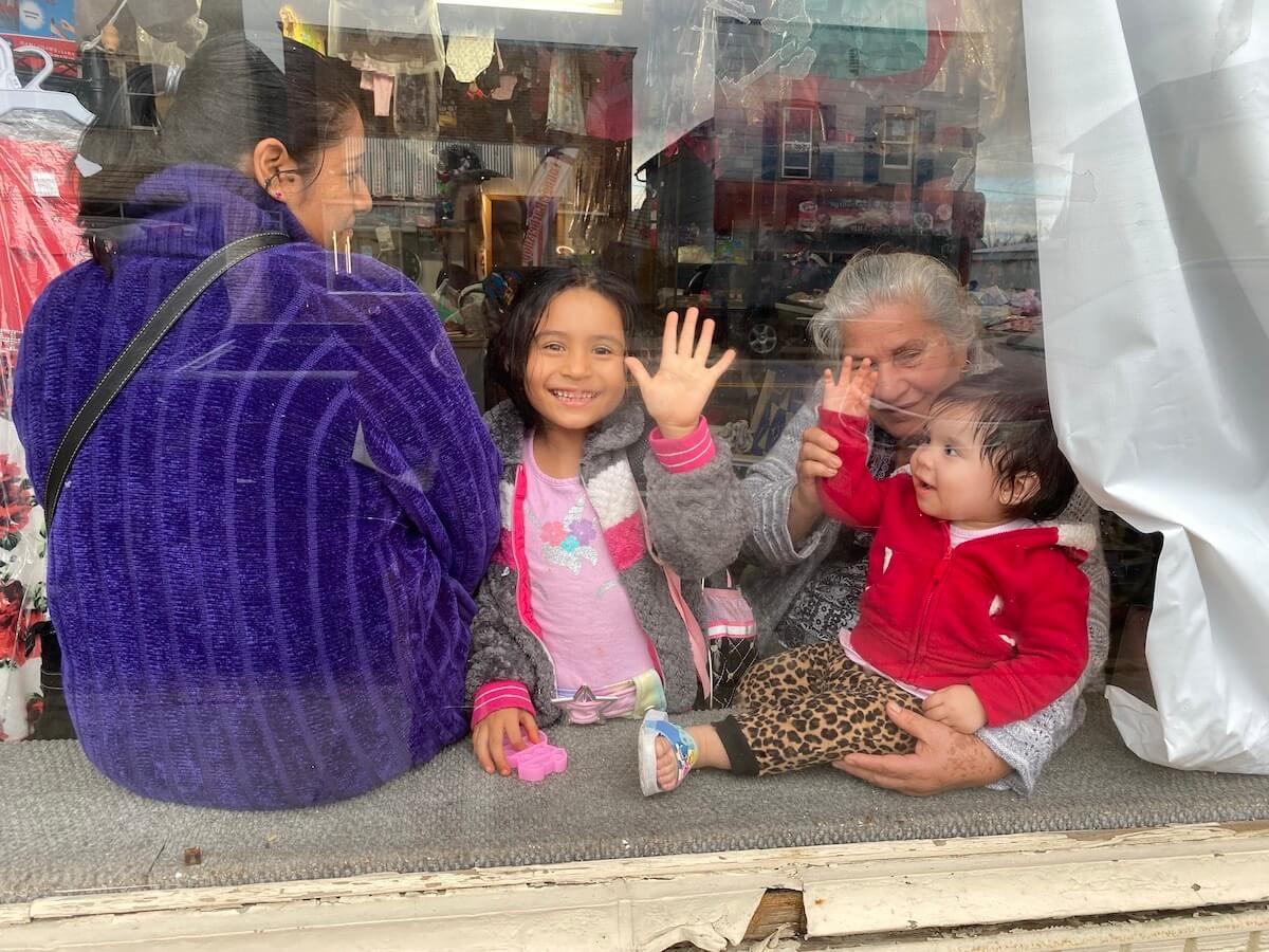A Latino family spends time together at a Latino-owned women's clothing store in downtown Arcadia on Oct. 12. Nearly half of the city's approximately 3,000 residents are Latino. (Photo by Julian Emerson)