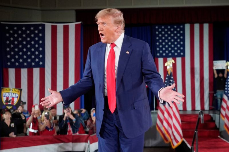 Donald Trump standing on stage at a rally in Waukesha