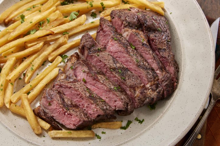 Medium Rare Strip Loin Steak with Shoe String French Fries and Mayo, as might be served in one of Wisconsin's supper clubs