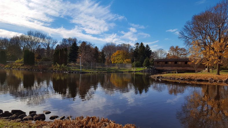 A scenic Autumn view of Fond du Lac's lakeside park over the water inlet from Lake Winnebago. This is one of the best fishing spots in Wisconsin