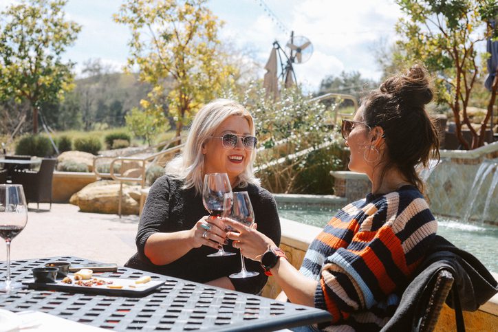 Female friends having food and wine together in one of America's many wineries