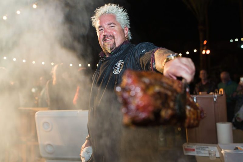 MIAMI BEACH, FL - FEBRUARY 27: Guy Fieri grilling at the 2016 Food Network & Cooking Channel South Beach Wine & Food Festival Presented By FOOD & WINE at Surfcomber Hotel on February 27, 2016 in Miami Beach, Florida. (Photo by Dylan Rives/Getty Images for SOBEWFF®)