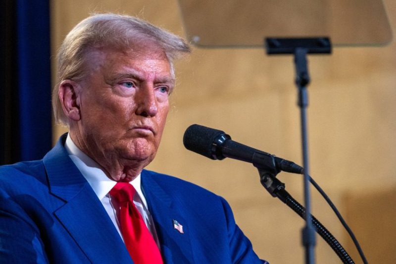 Trump speaking to microphone