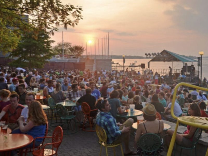 people seated outside madison night market