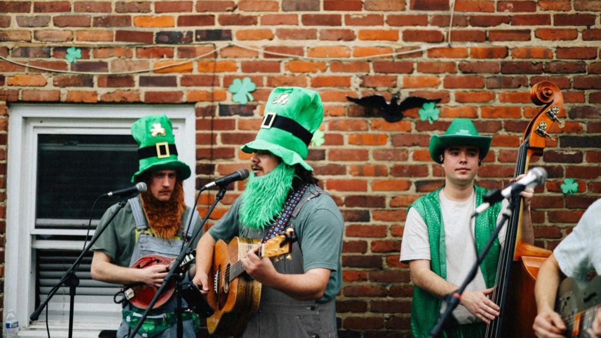 band dressed in irish gear playing music 
