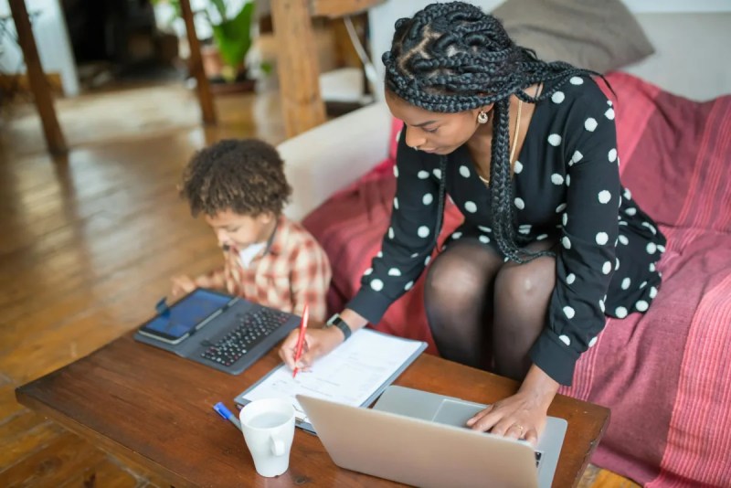 mother and child sitting at coffee table