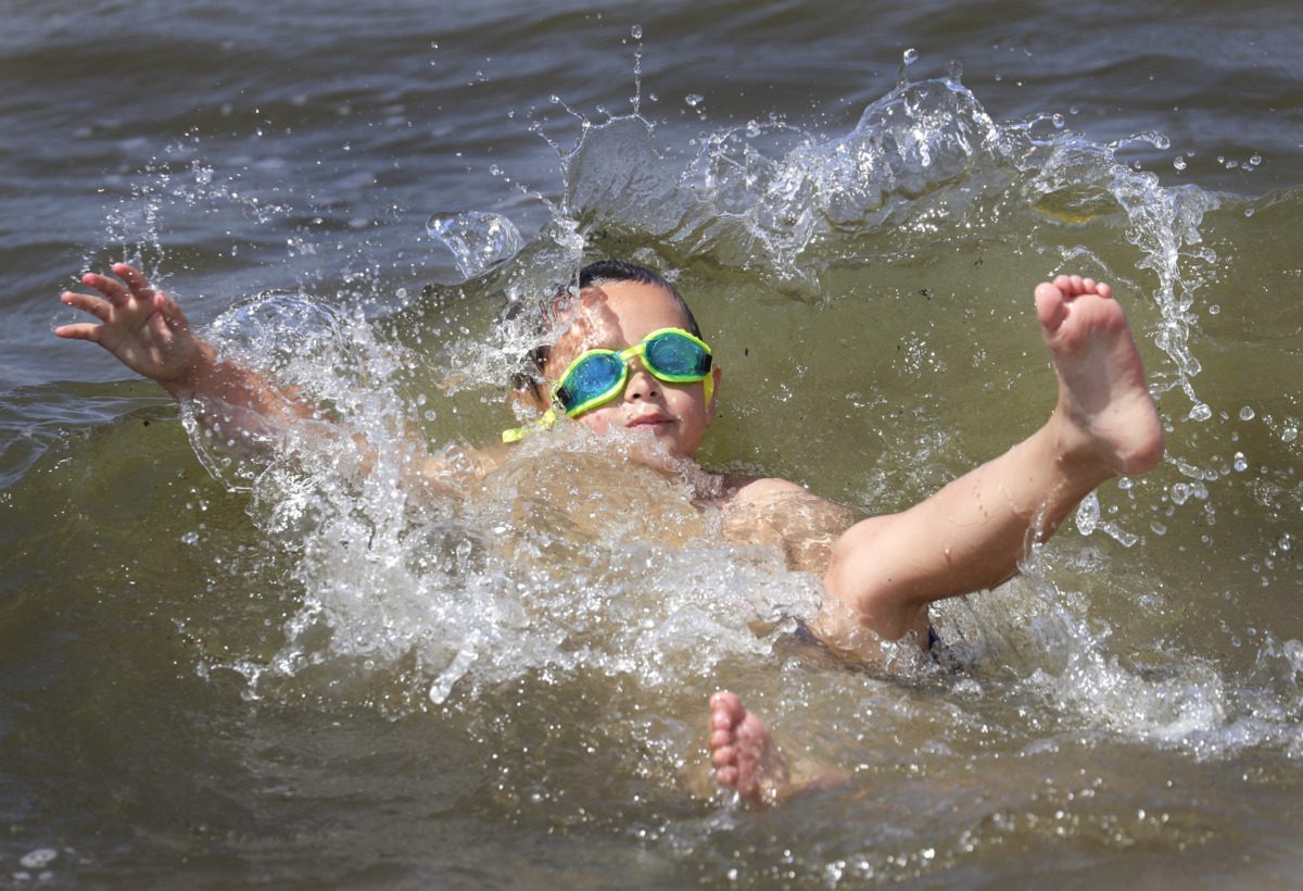 child splashing in water