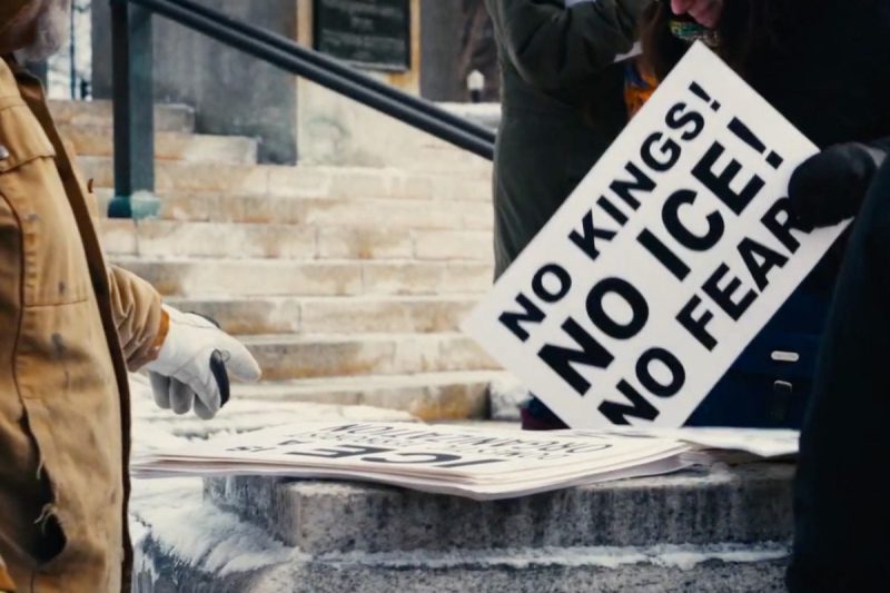 photo of person holding sign that reads "No Kings! No ICE! No fear!